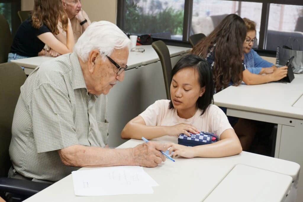 retirement man tutoring and young person