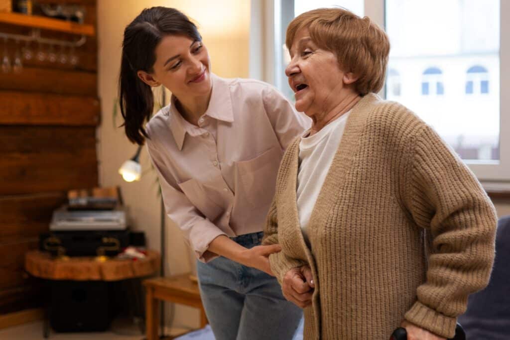 Young millennial caring for her elderly grandparent.