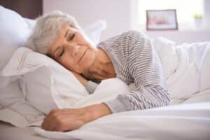 Senior having a good night sleep to regulate stress hormones and maintain good blood pressure.