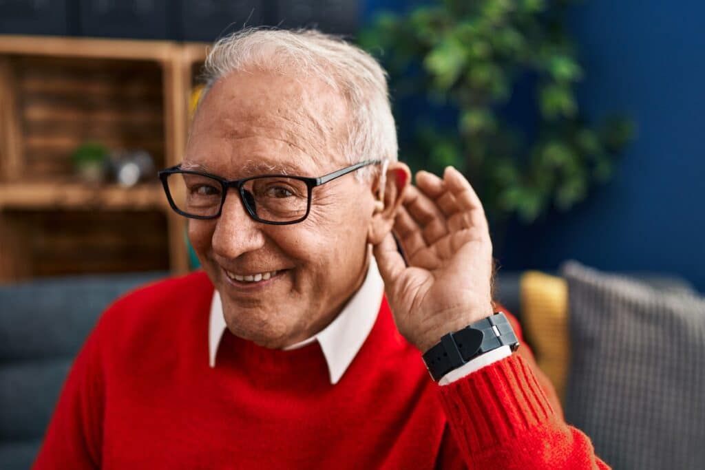 Senior man with hearing loss embracing life by understanding the symptoms and prevention.