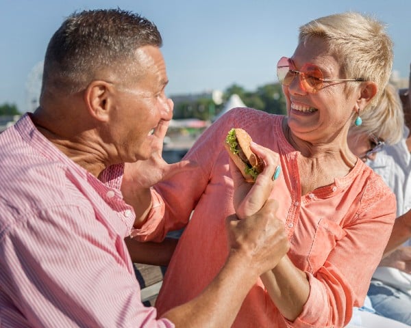 Senior Couple enjoying the outdoors knowing they are nurturing healthy skin.