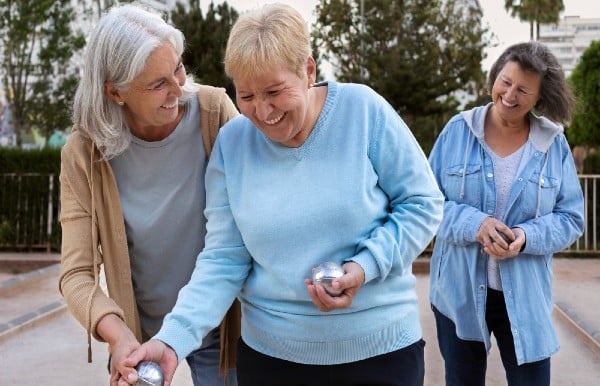 Joyful senior enjoying meaningful companionship with a Promyse Home Care professional.