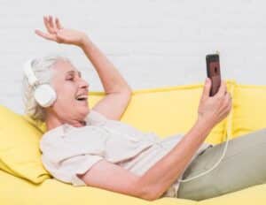 Stroke Survivor listening to music to help her stay motivated and engaged with her recovery.