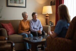 Senior couple d discussing the steps of aging in place in their home.
