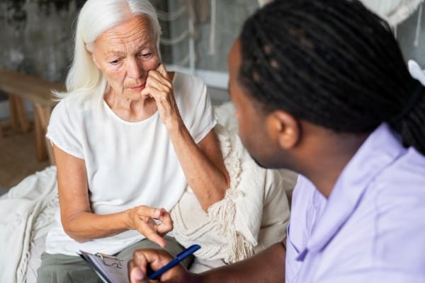 PSW trying to discuss the symptoms of dementia to a senior woman refusing to accept the diagnosis.