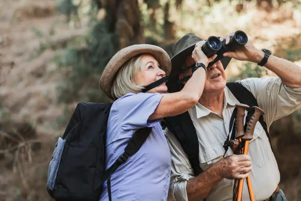 Senior couple are enjoying birdwatching in a Kitchener park