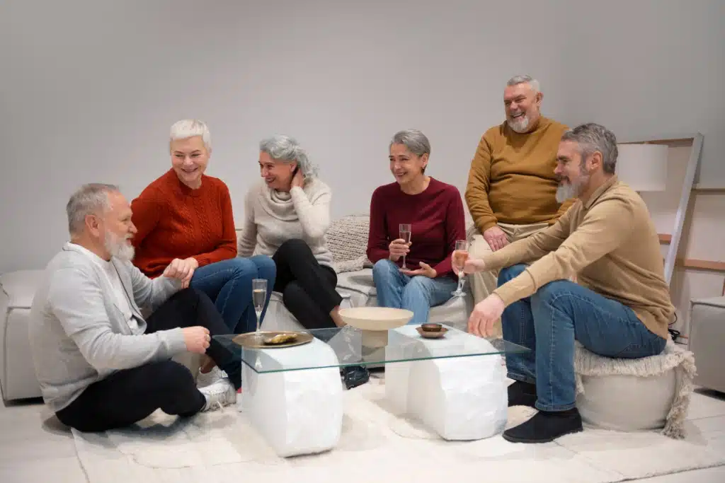 Group of seniors having a conversation about safety for elderly persons.