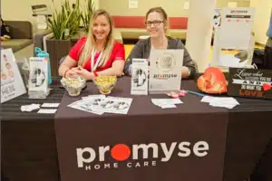 Ashley and Martha hosting an event for Promyse Home Care