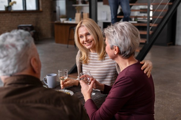 Family members are discussing types of scams and how to protect against them
